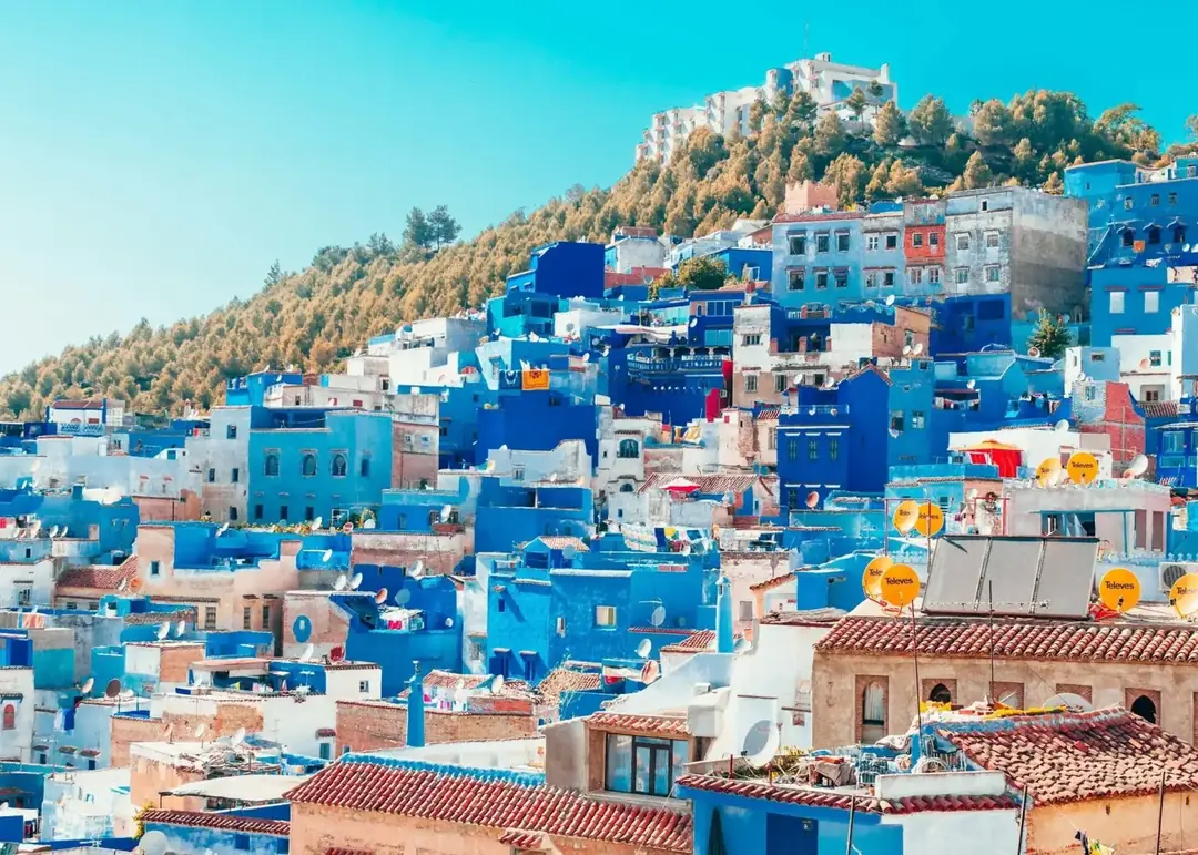 Blue-washed houses stepping up a hillside in Chefchaouen