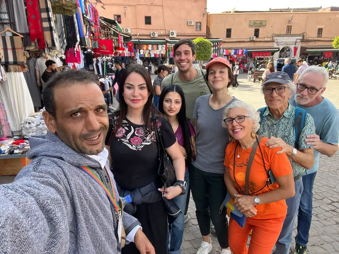 Youssef with a group of travellers in the souk