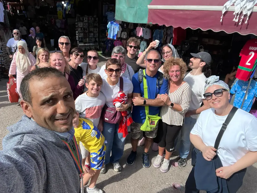 Youssef taking a group selfie in the souks