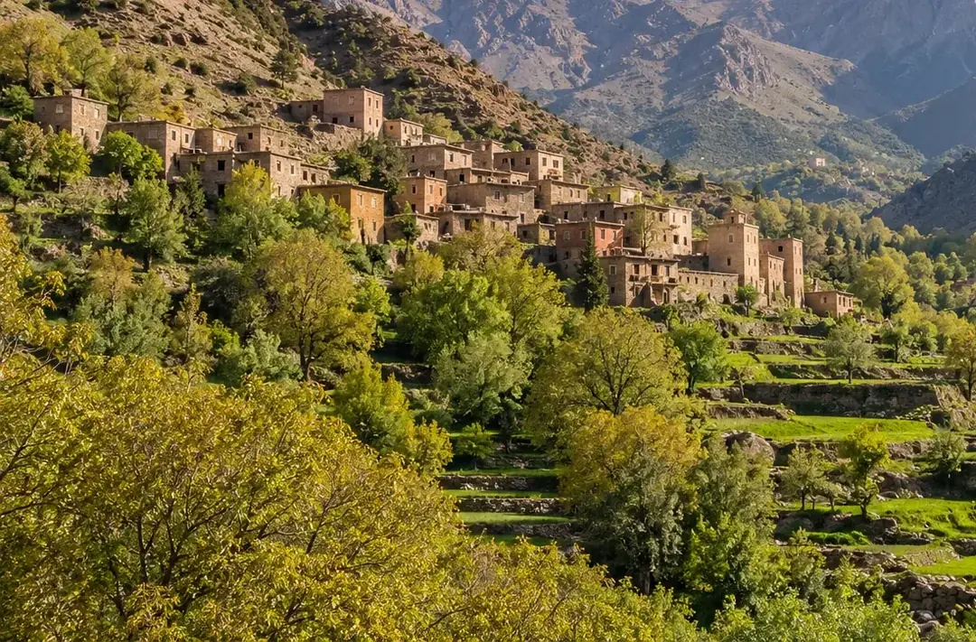 A terraced Amazigh village among green slopes in the High Atlas near Imlil